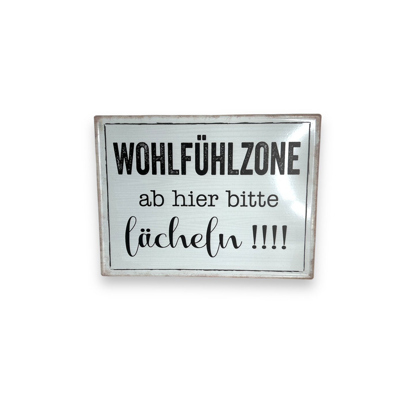 Schild: Wohlfühlzone, ab hier bitte lächeln!!!