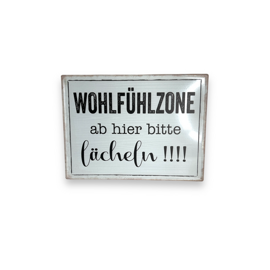 Schild: Wohlfühlzone, ab hier bitte lächeln!!!